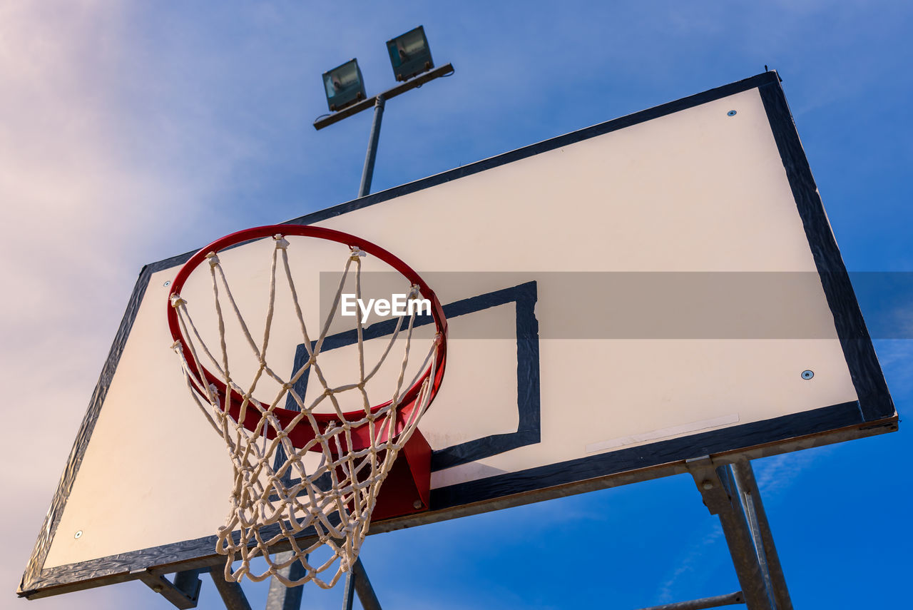 Low angle view of basketball hoop against sky