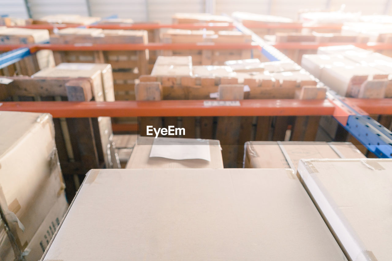 Shelves with goods in the carton boxes in industry warehouse storage of factory