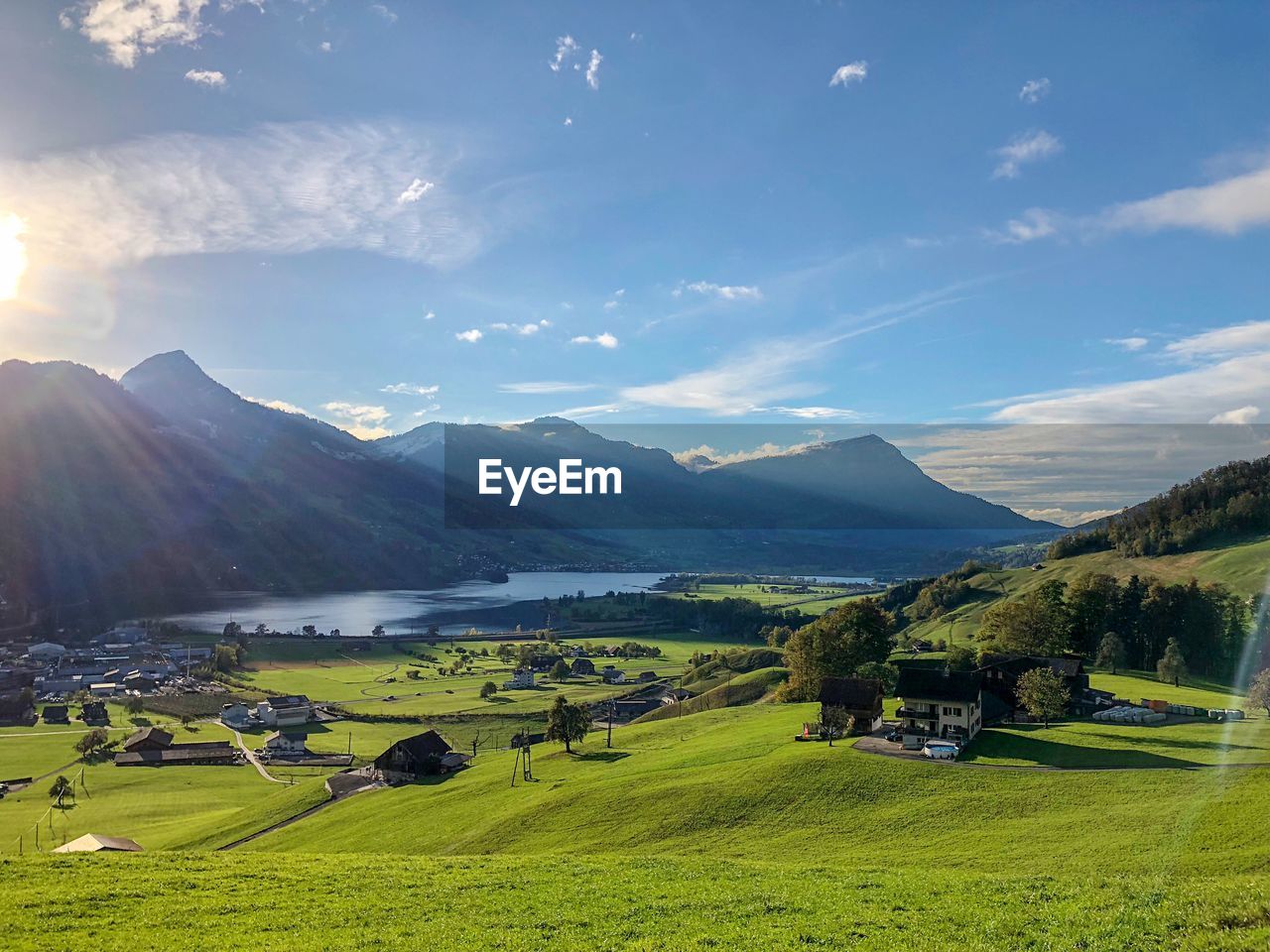 Scenic view of farm against sky