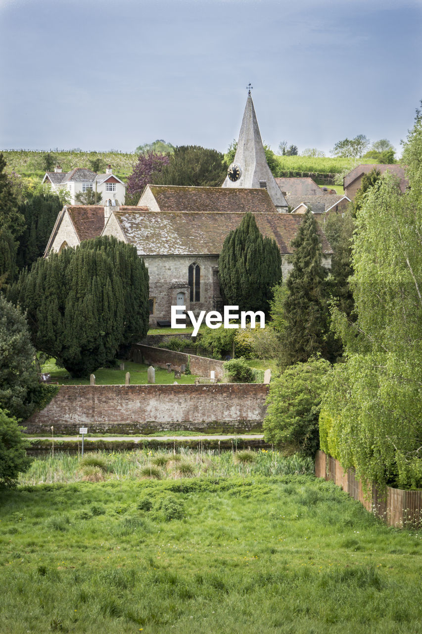 View of all saints church in the village of loose, kent, uk