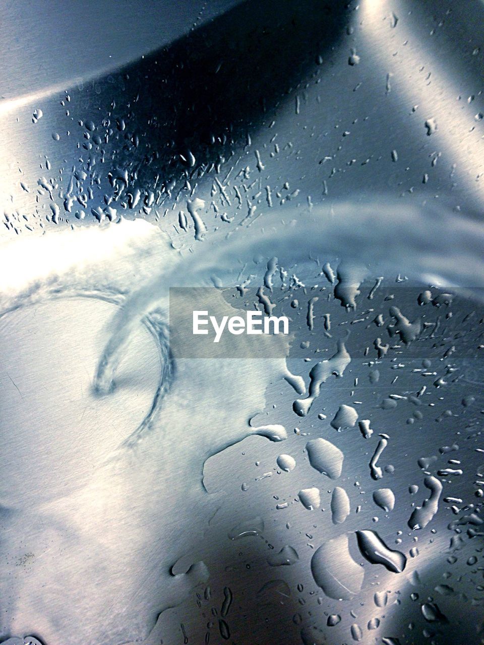 Flowing water in kitchen sink