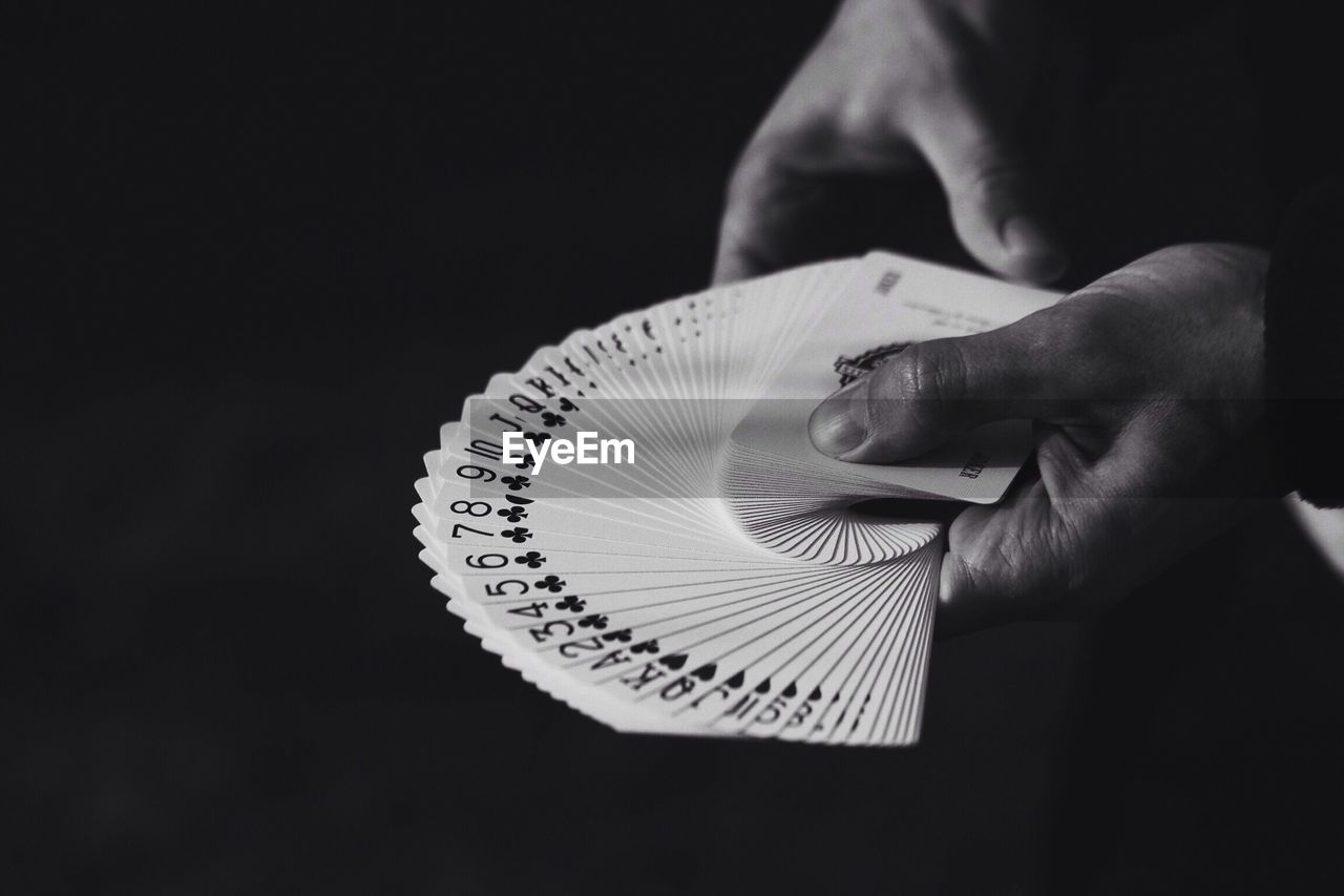 Close-up of hands with cards