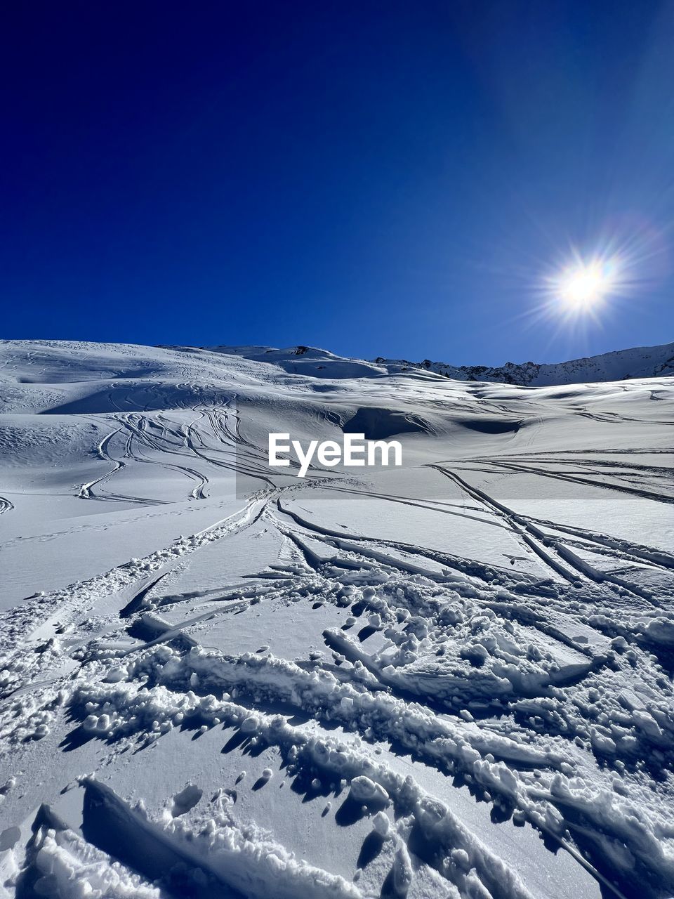 scenic view of snowcapped mountains against clear sky