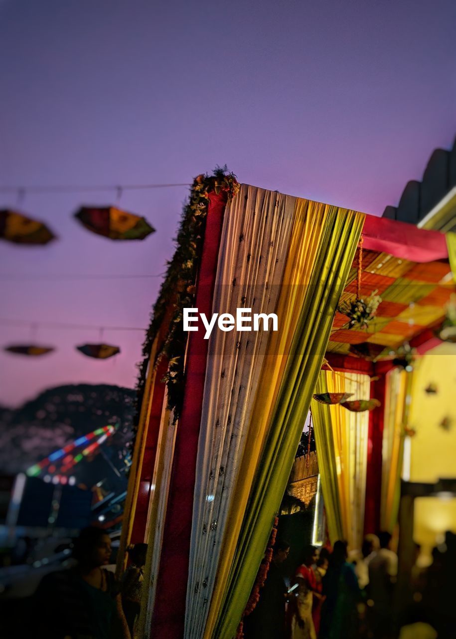 Low angle view of amusement park ride against sky