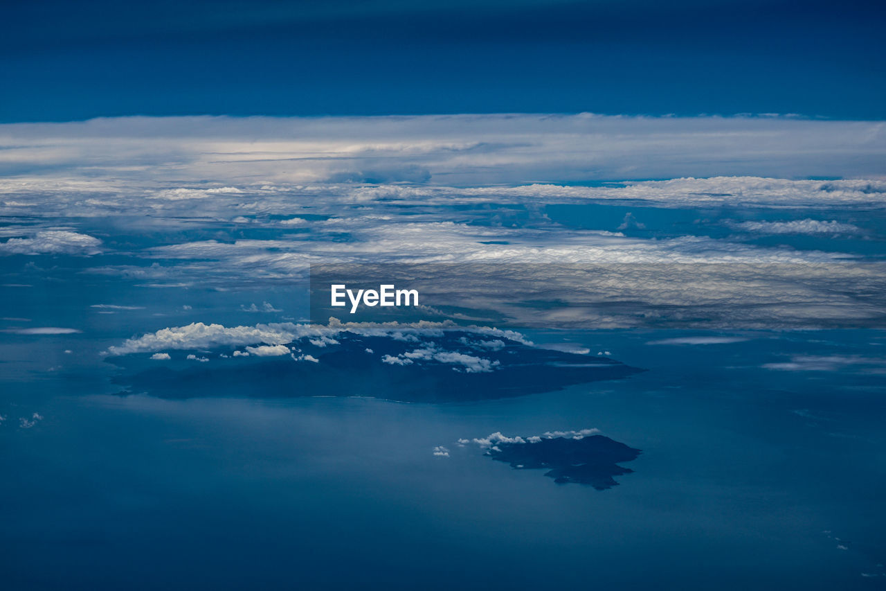 AERIAL VIEW OF SEA AND LANDSCAPE AGAINST SKY