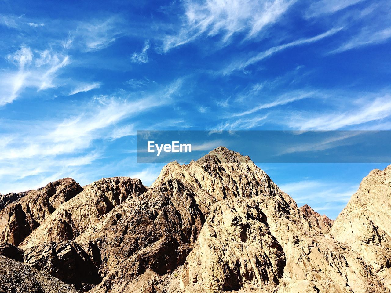 Low angle view of rocks against sky