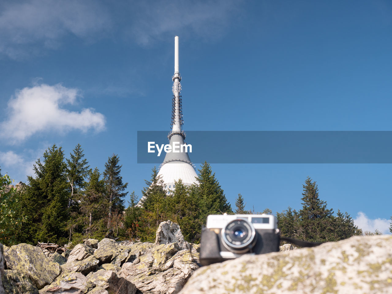 Vintage camera on stone and popular peak of jested preak. classic film camera photographers event