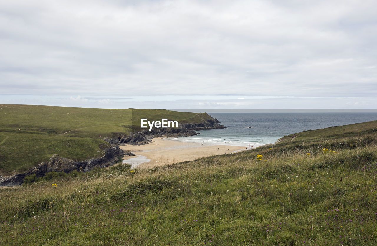 SCENIC VIEW OF SEA AND BEACH AGAINST SKY