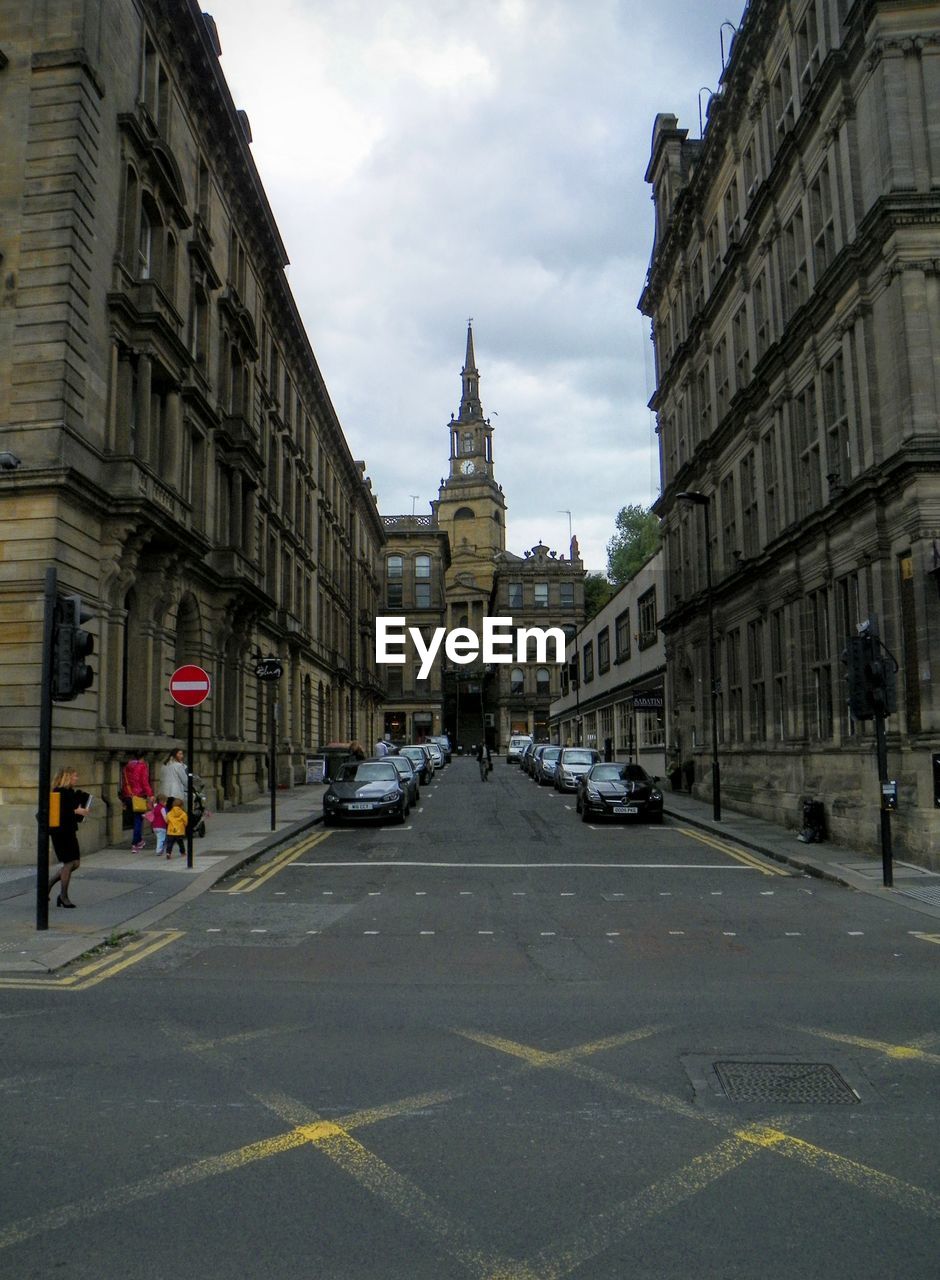 Car parked on road by buildings