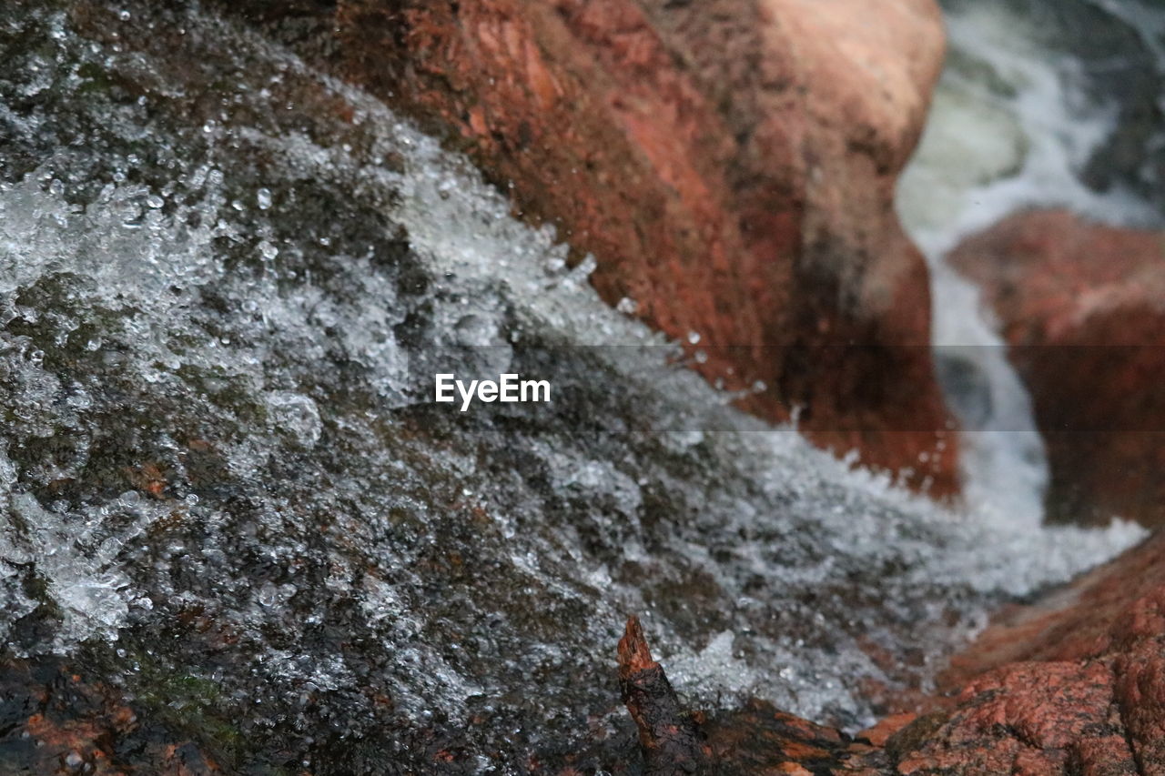 WATER FLOWING THROUGH ROCKS