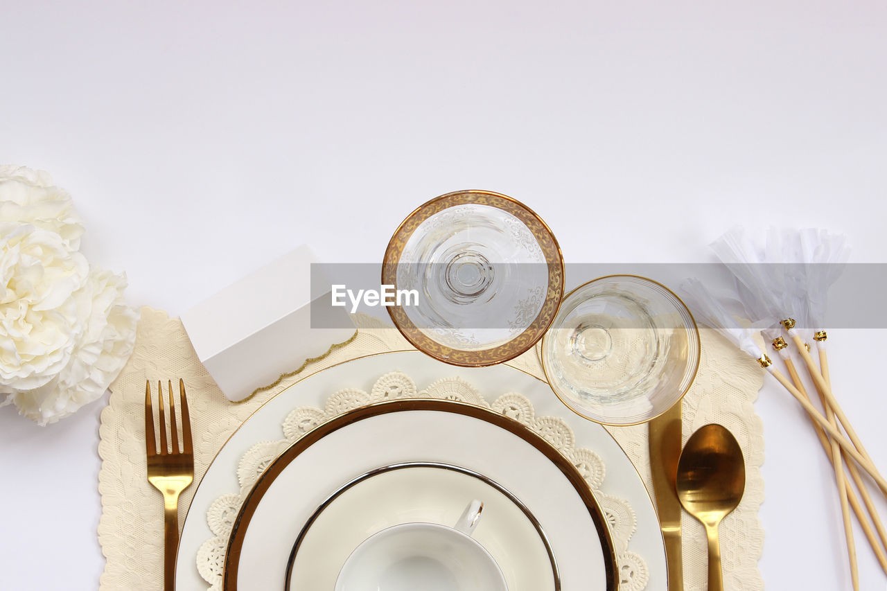 Directly above view of place setting on white table