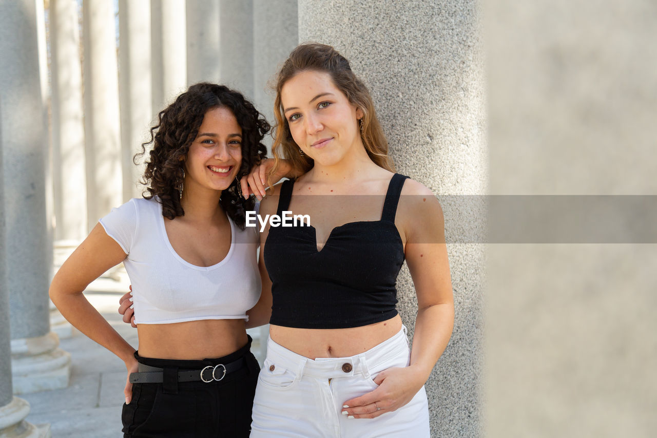 Young women friends enjoying in the city park