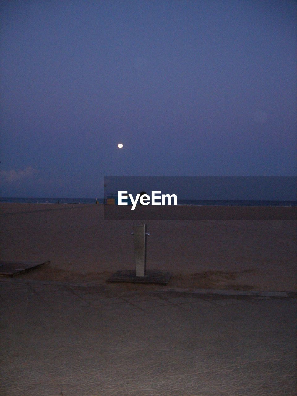 Scenic view of beach against blue sky