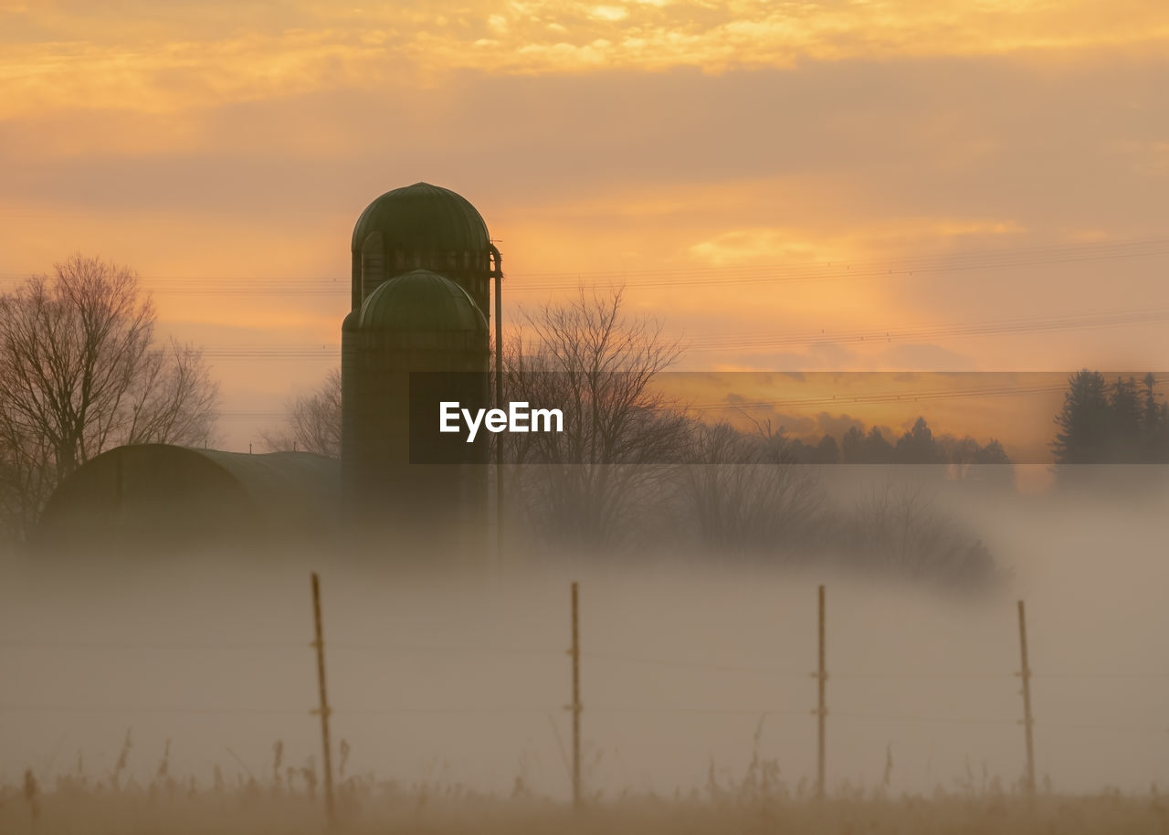 Scenic view of field against sky during sunset