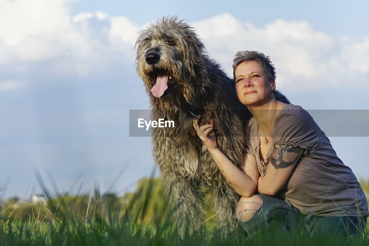 Portrait of woman with irish wolfhound