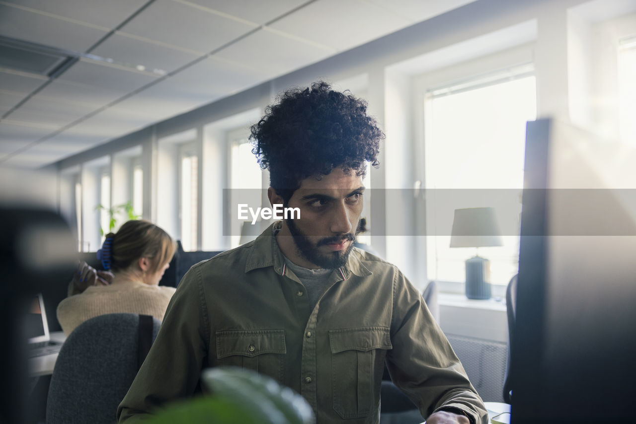 Concentrated man working in office