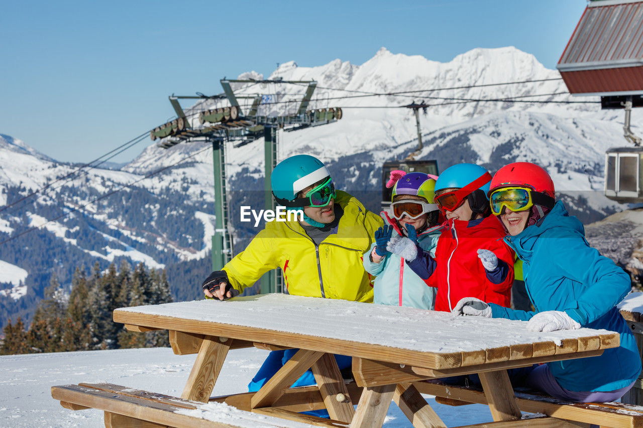 low angle view of people on snow covered landscape