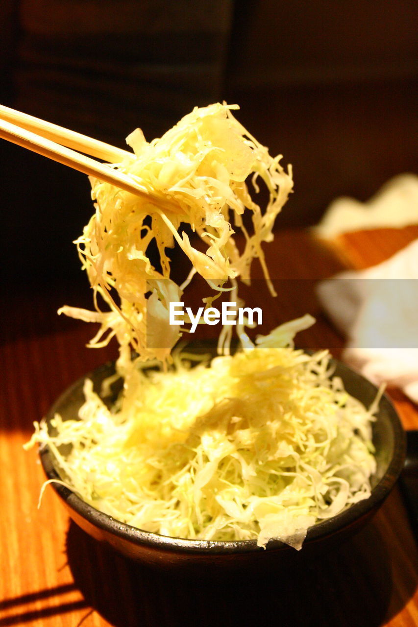 CLOSE-UP OF ICE CREAM WITH BOWL