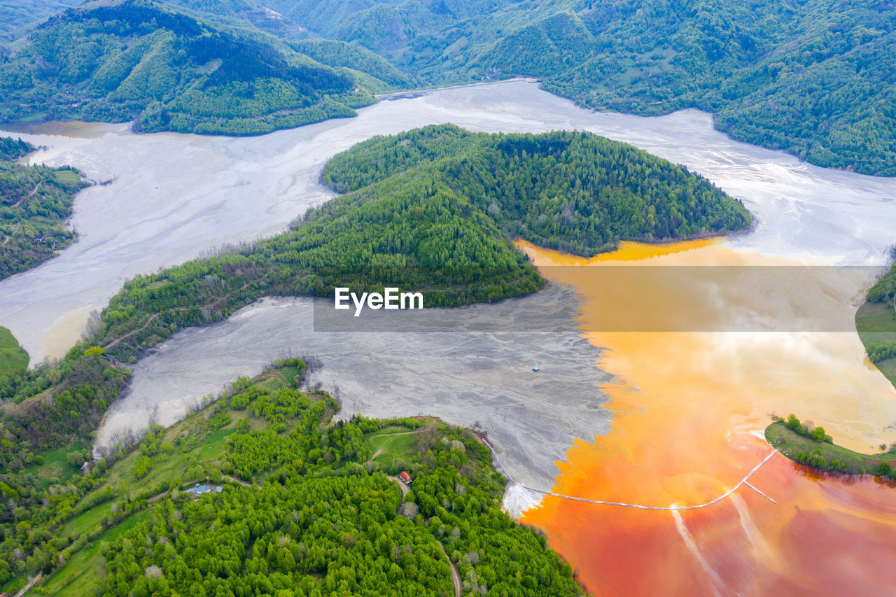 Aerial view of a big waste decanting lake. rosia poieni copper pit flooding the village of geamana