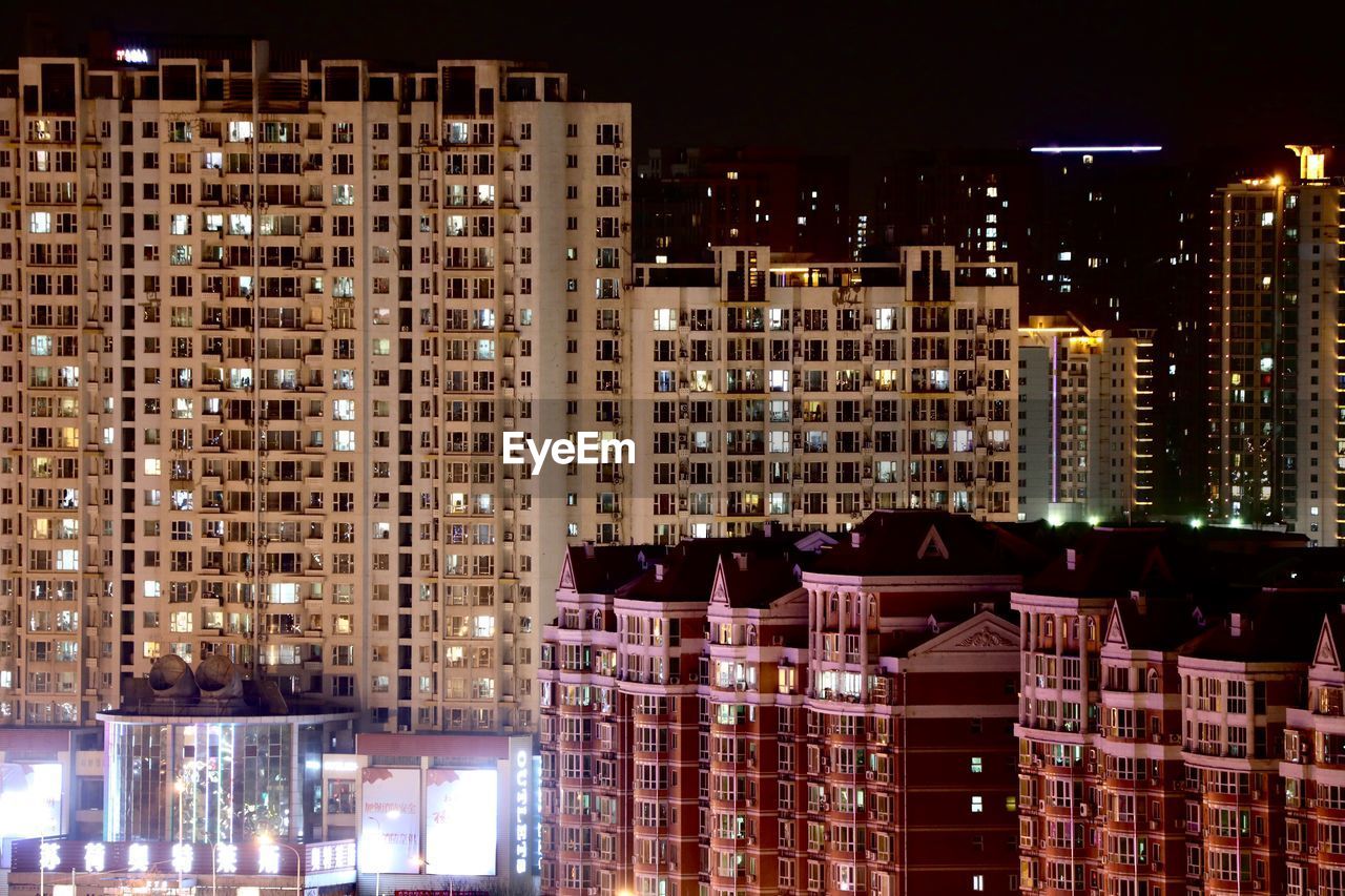 Modern buildings in city at night