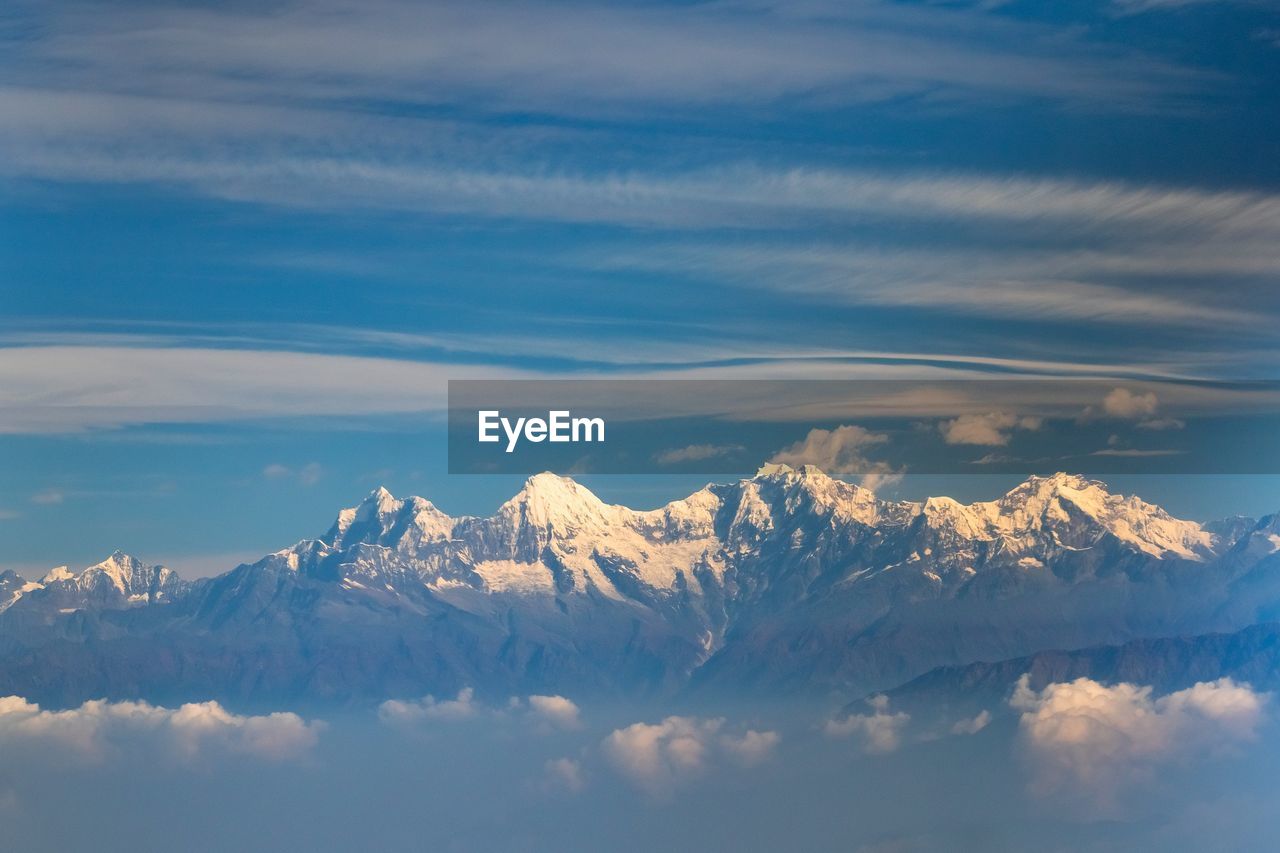 Scenic view of snowcapped mountains against sky