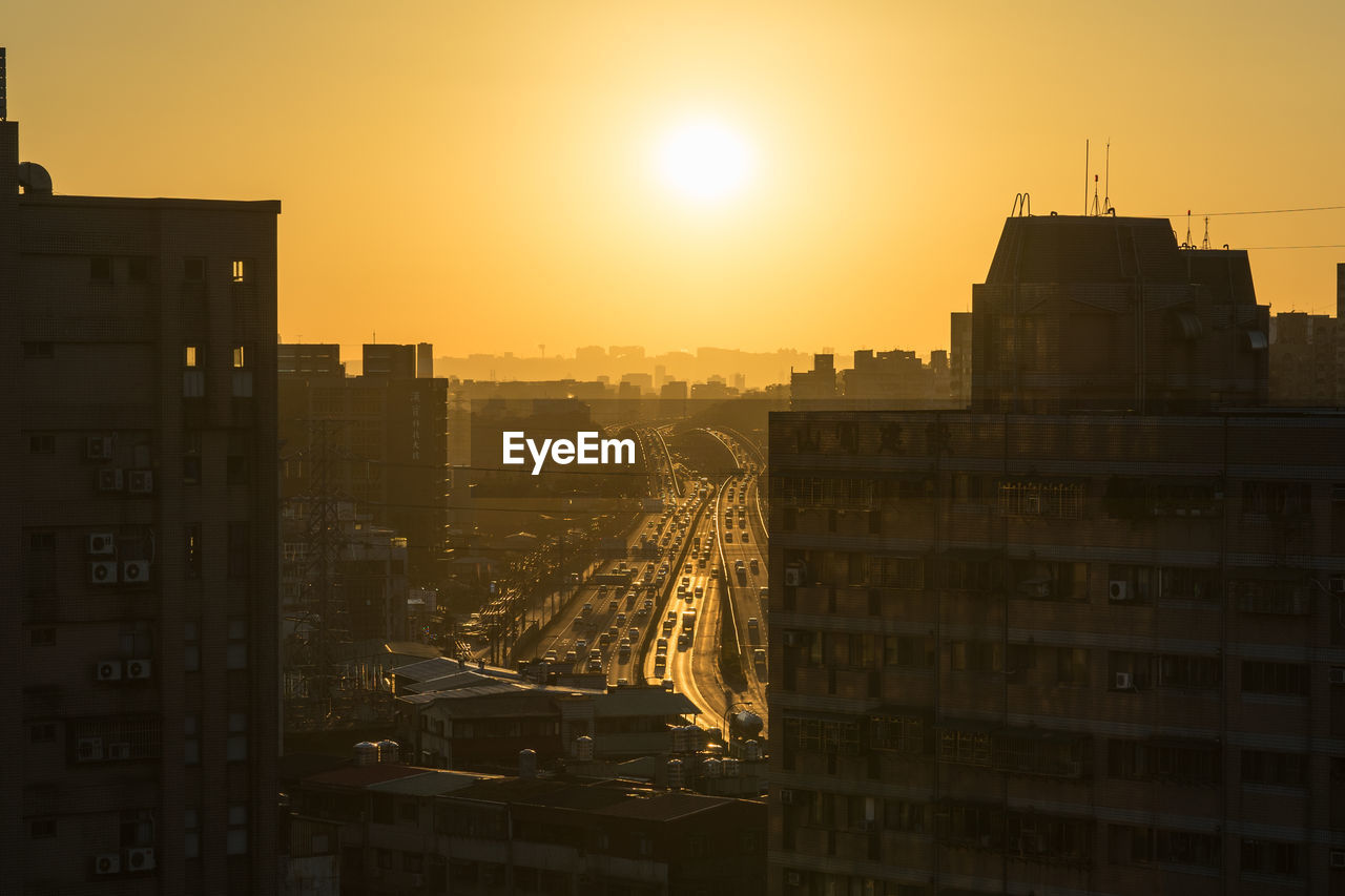 High angle view of buildings at sunset