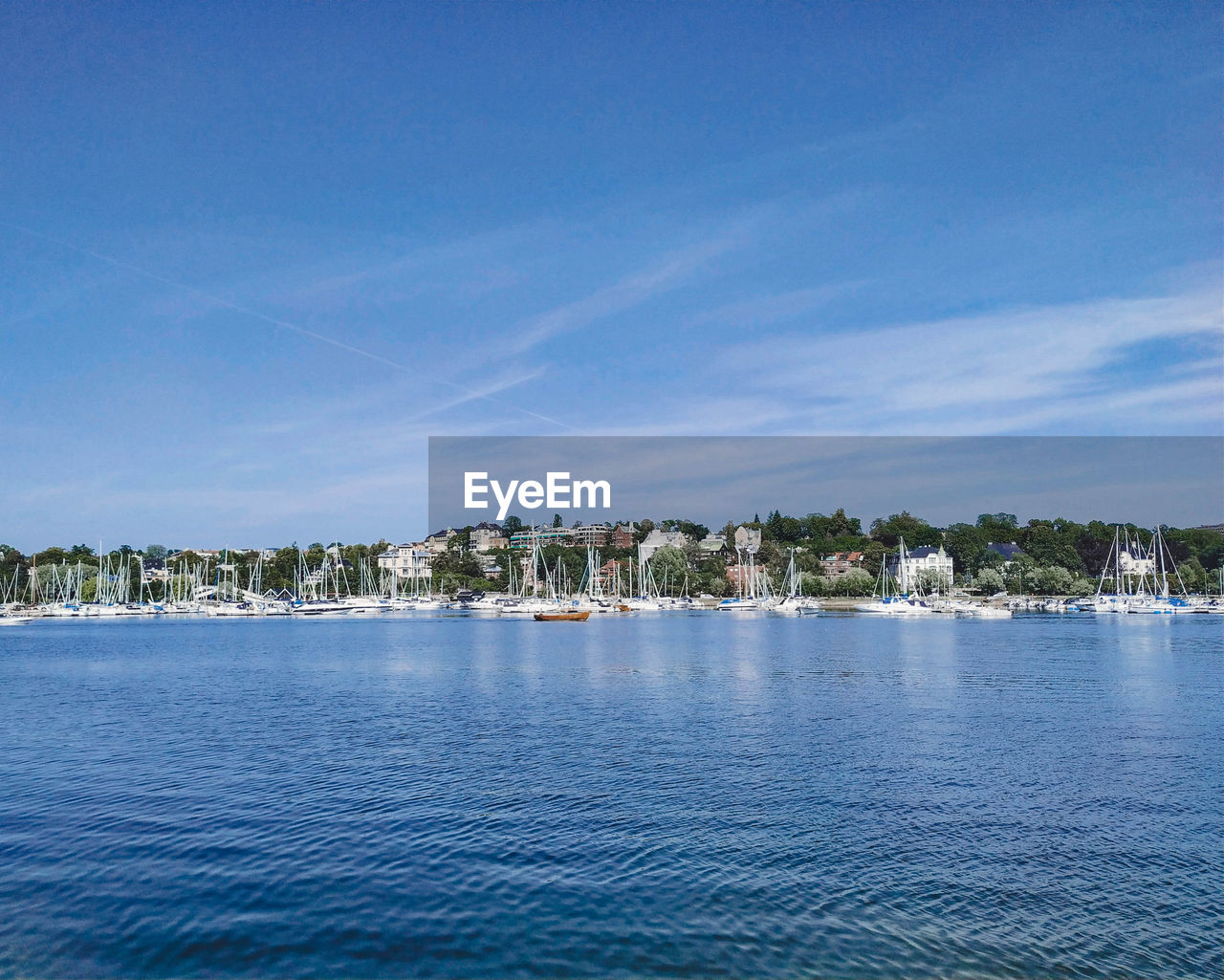 SCENIC VIEW OF SEA BY BUILDINGS AGAINST SKY