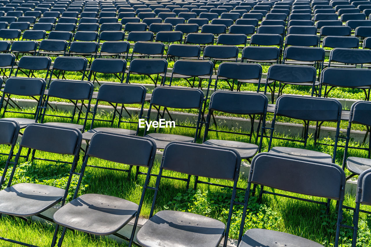 Full frame shot of empty chairs in stadium