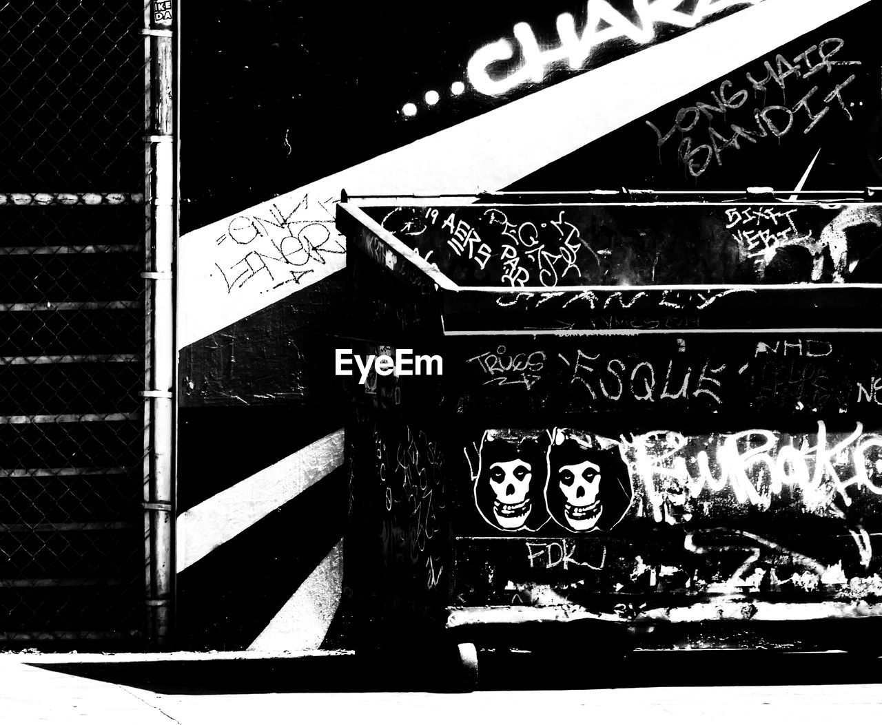 CLOSE-UP OF GRAFFITI ON METAL STRUCTURE