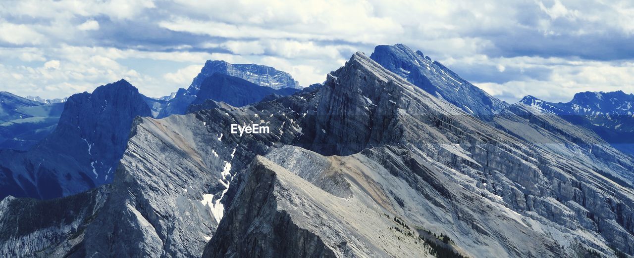 Panoramic view of snowcapped mountains against sky