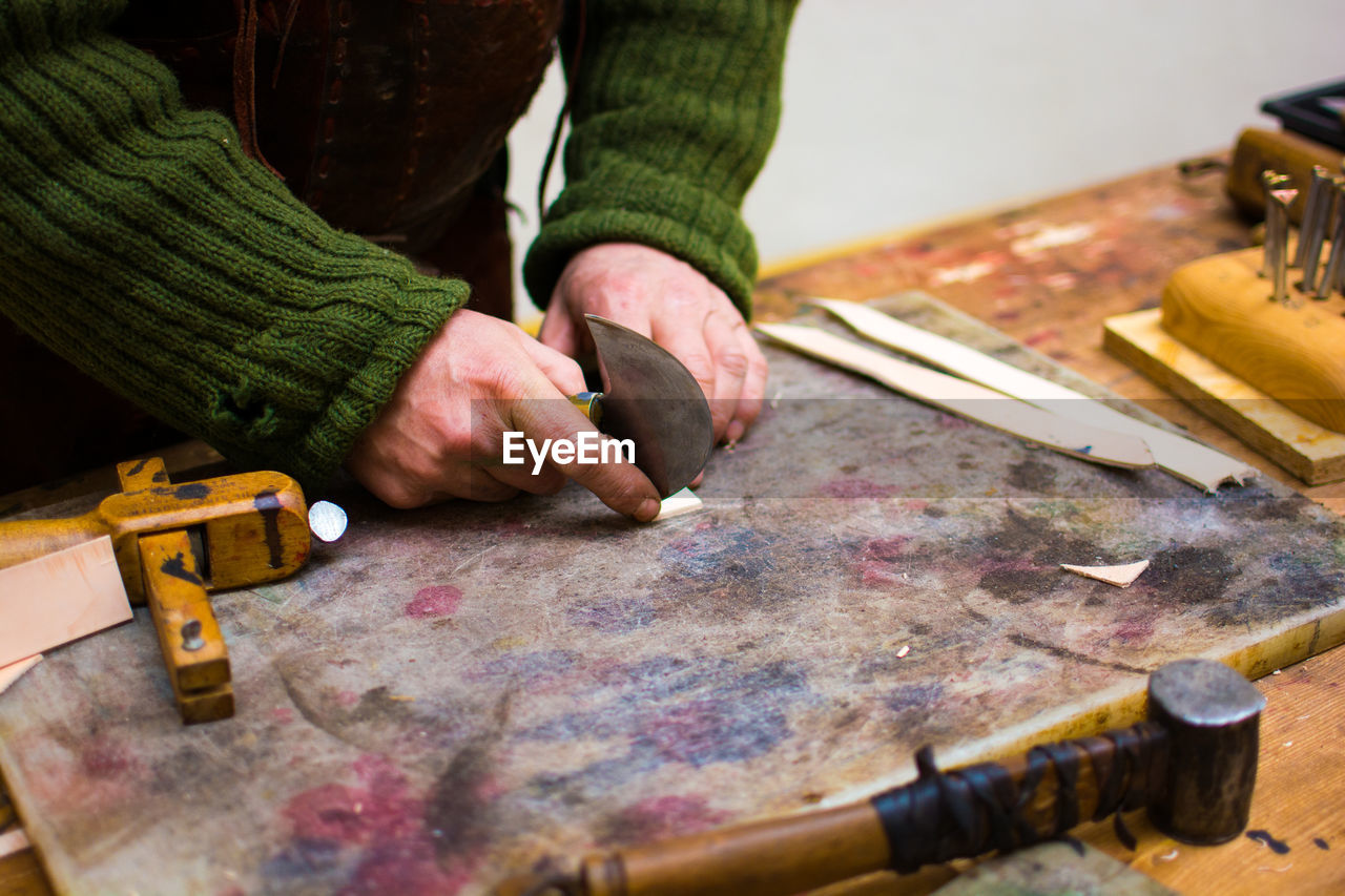 Cropped image of man working in workshop