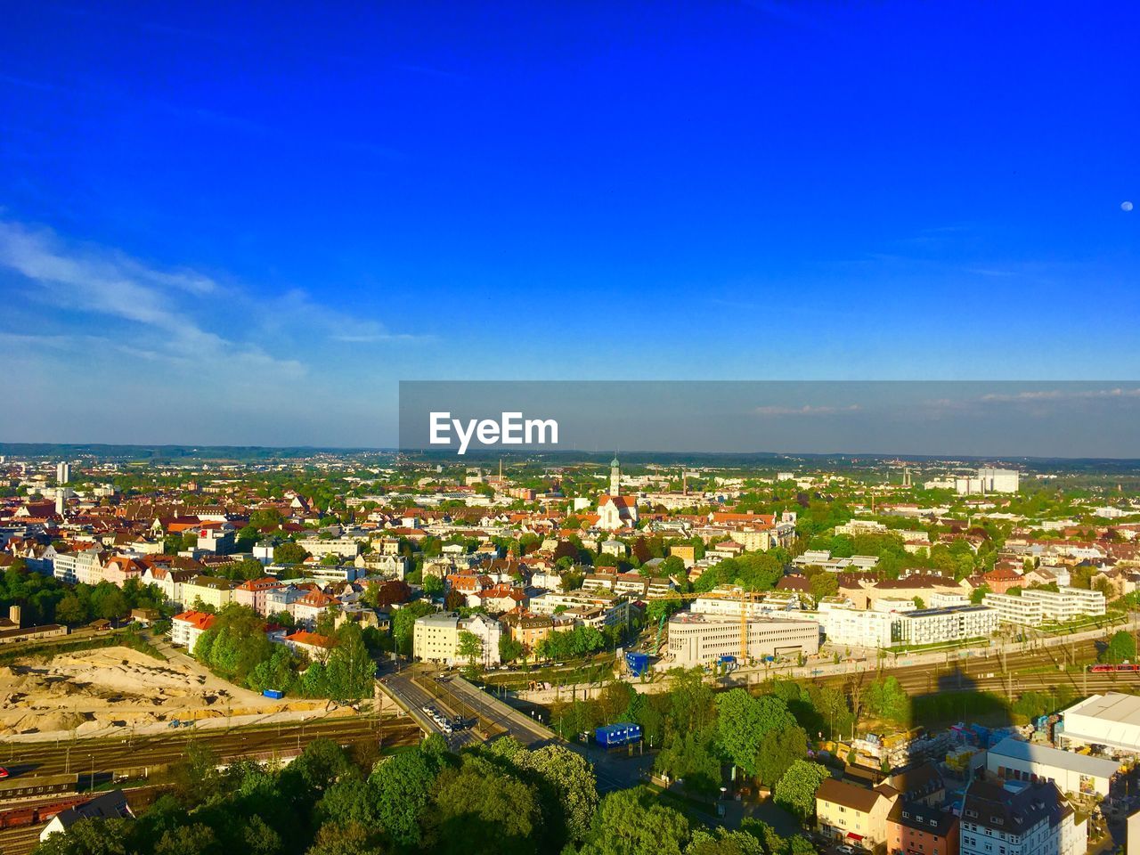 High angle view of townscape against blue sky