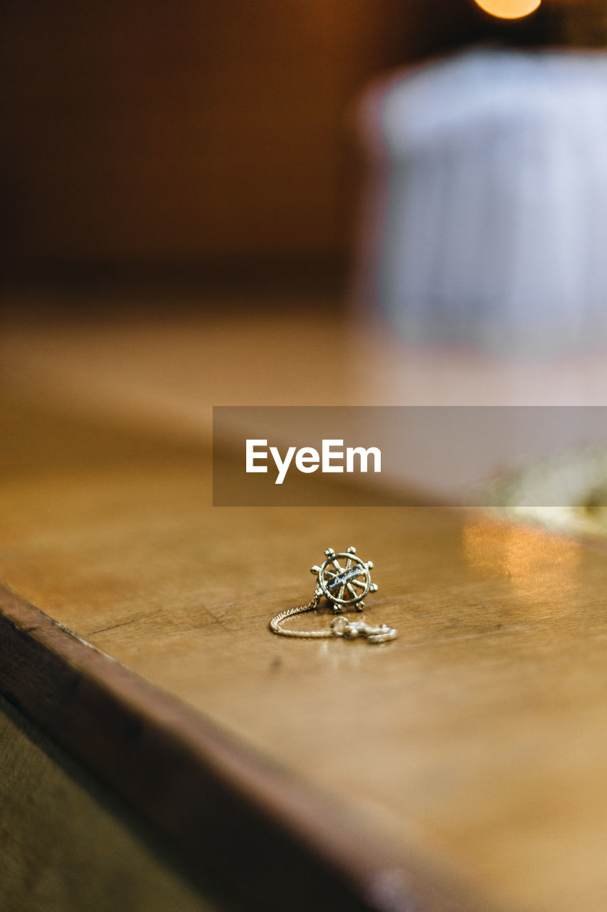 Close-up of jewelry on wooden table