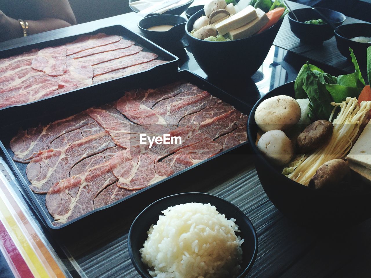 High angle view of shabu-shabu ingredients on table