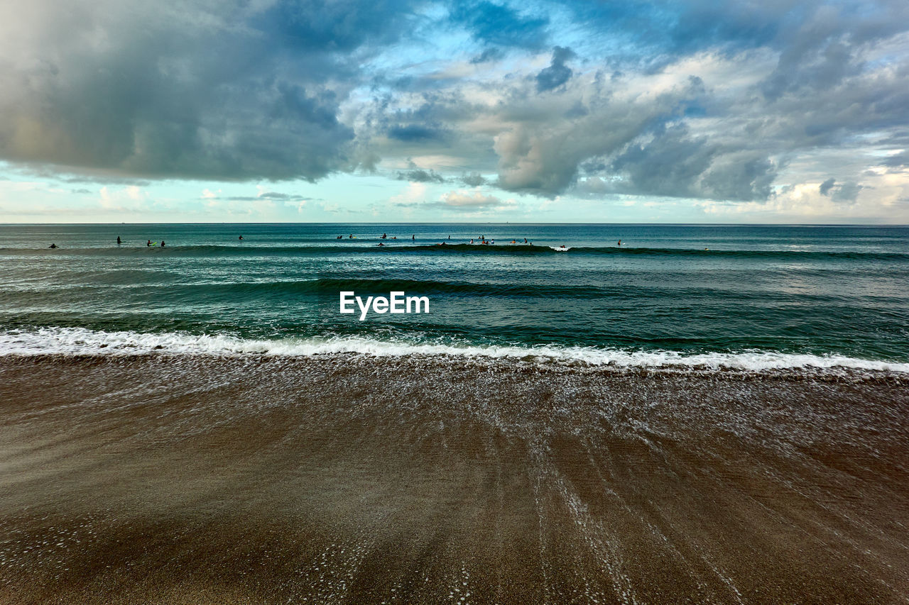 SCENIC VIEW OF SEA WAVES AGAINST SKY