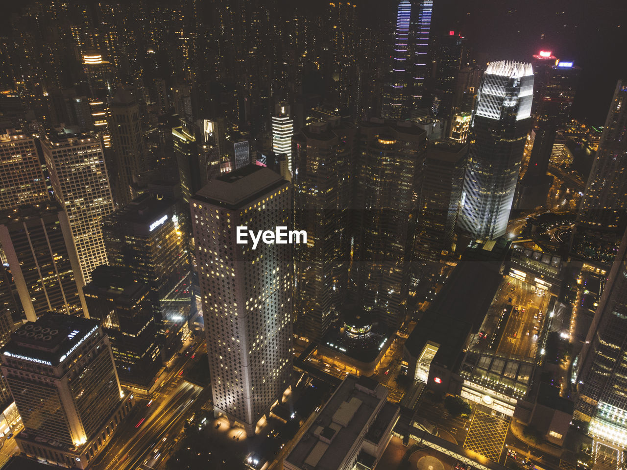 Aerial view of illuminated buildings in city at night