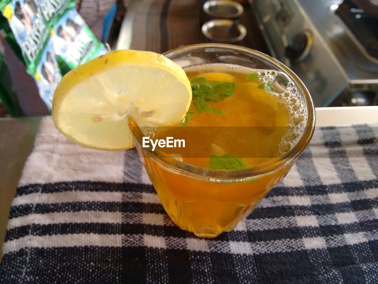 CLOSE-UP OF DRINK ON WOODEN TABLE