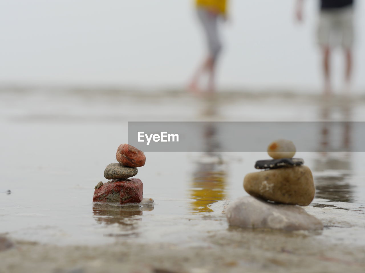 Close-up of stack of stones on beach