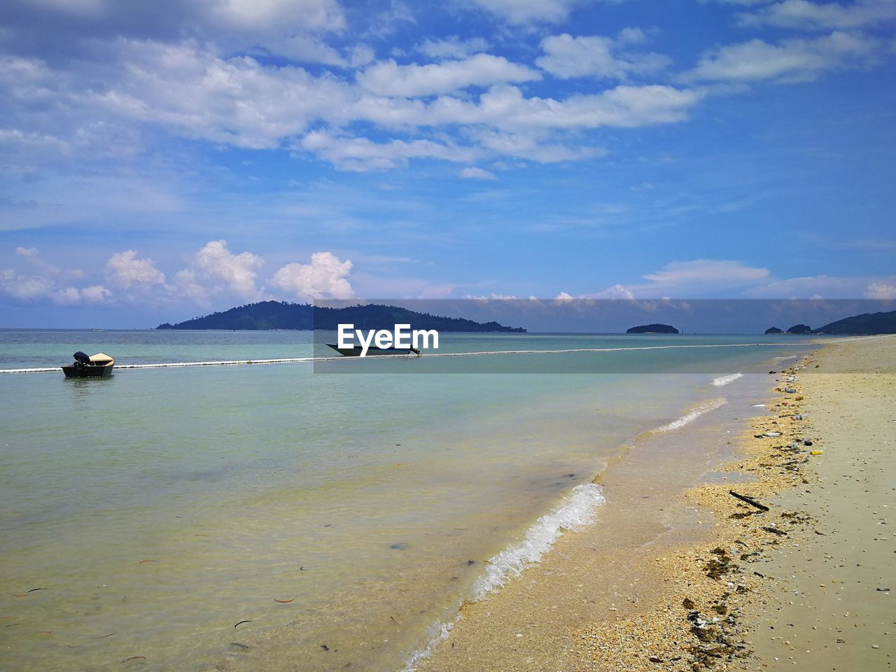 VIEW OF BEACH AGAINST SKY