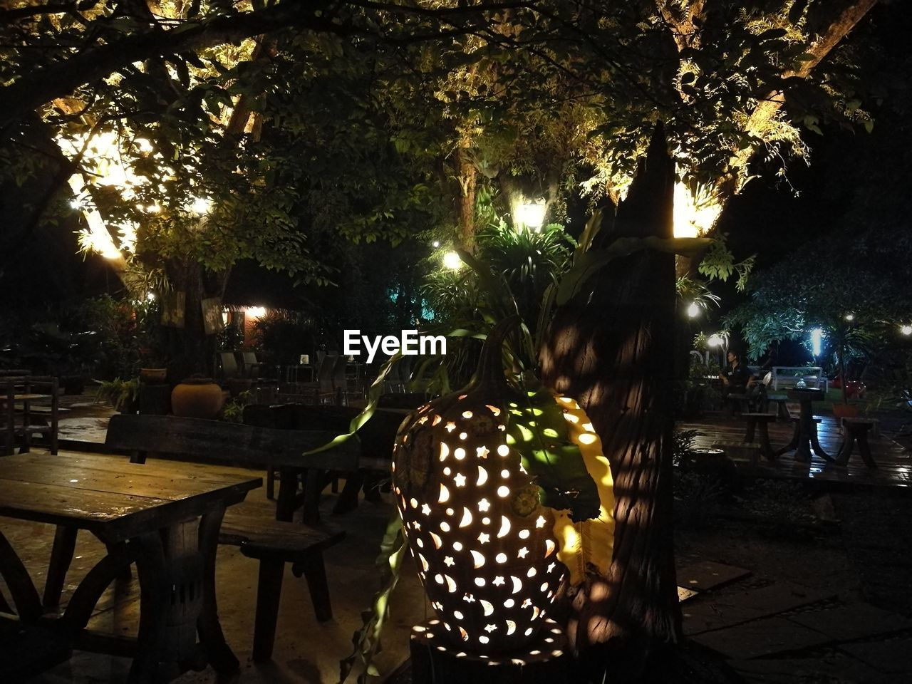 MAN AND WOMAN AT ILLUMINATED TABLE