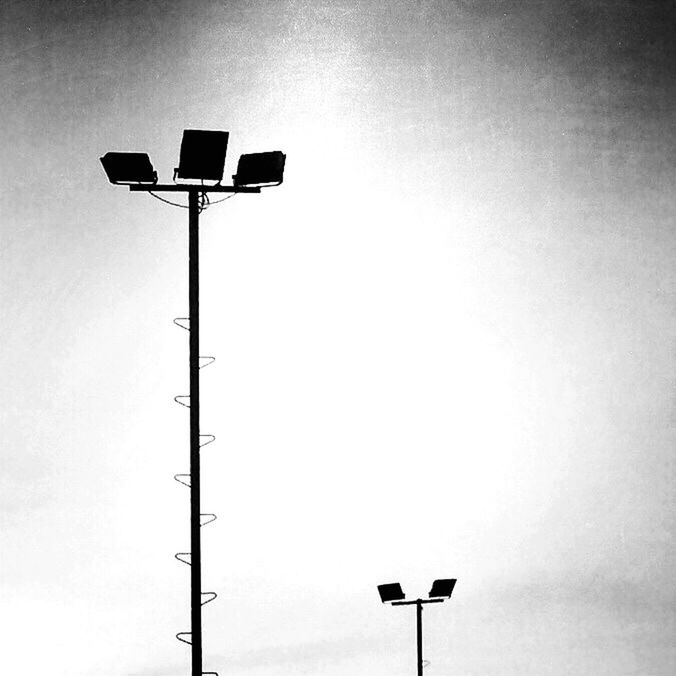 LOW ANGLE VIEW OF STREET LIGHT AGAINST SKY