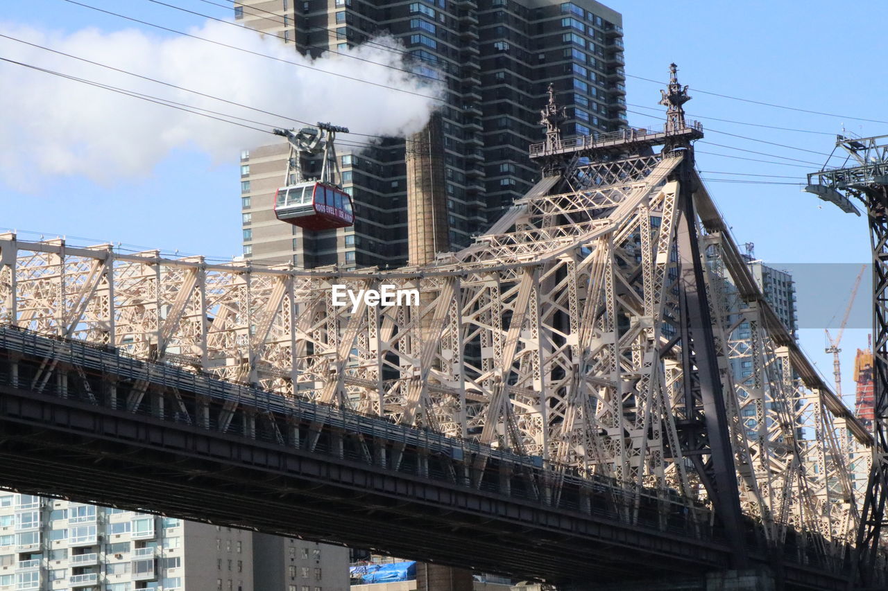 LOW ANGLE VIEW OF BRIDGE CABLES AGAINST SKY