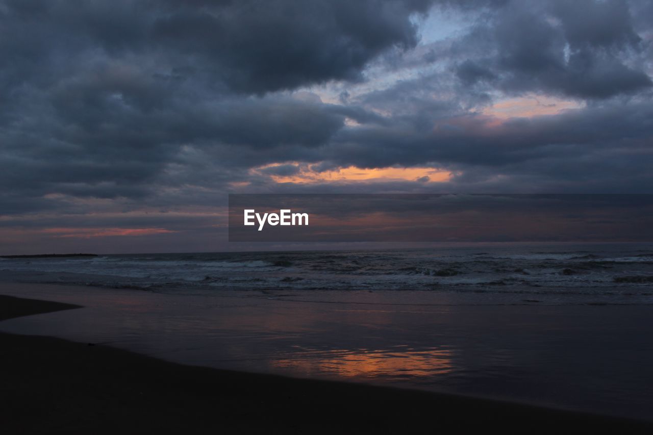 Scenic view of sea against dramatic sky