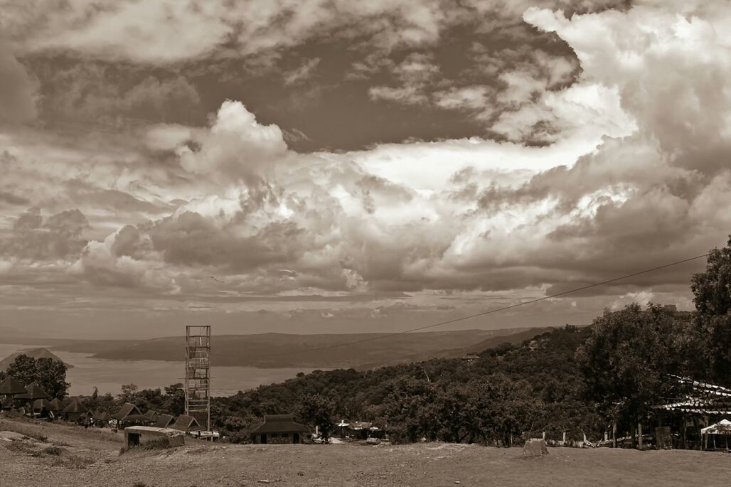 Scenic view storm clouds over landscape