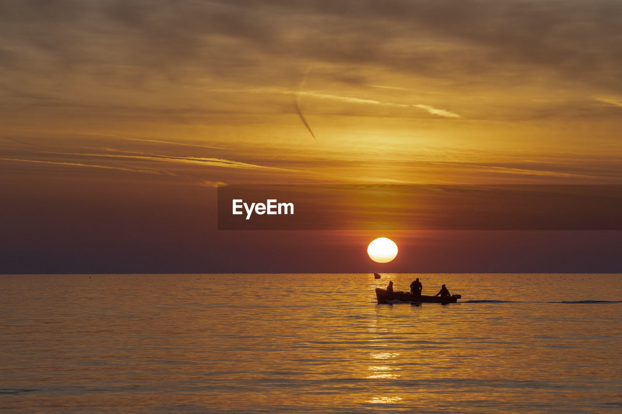 SCENIC VIEW OF SEA AGAINST ORANGE SKY