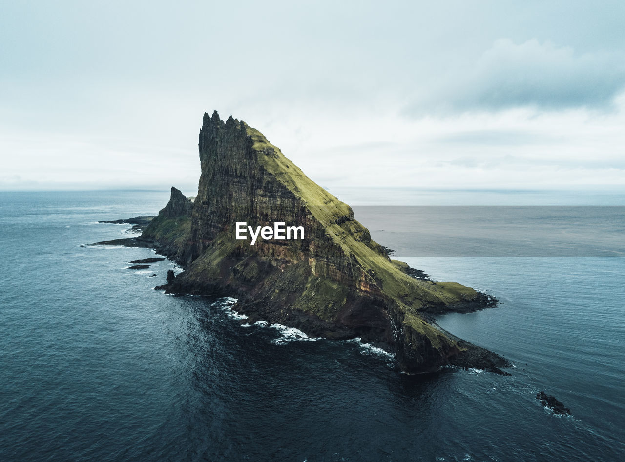 Aerial view of the rugged tindhólmur island on the faroe islands.