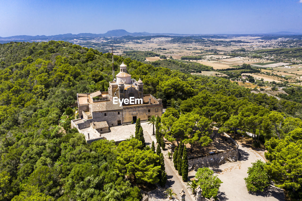 Aerial shot of santuari de bonany monastery on sunny day, petra, balearic islands, spain
