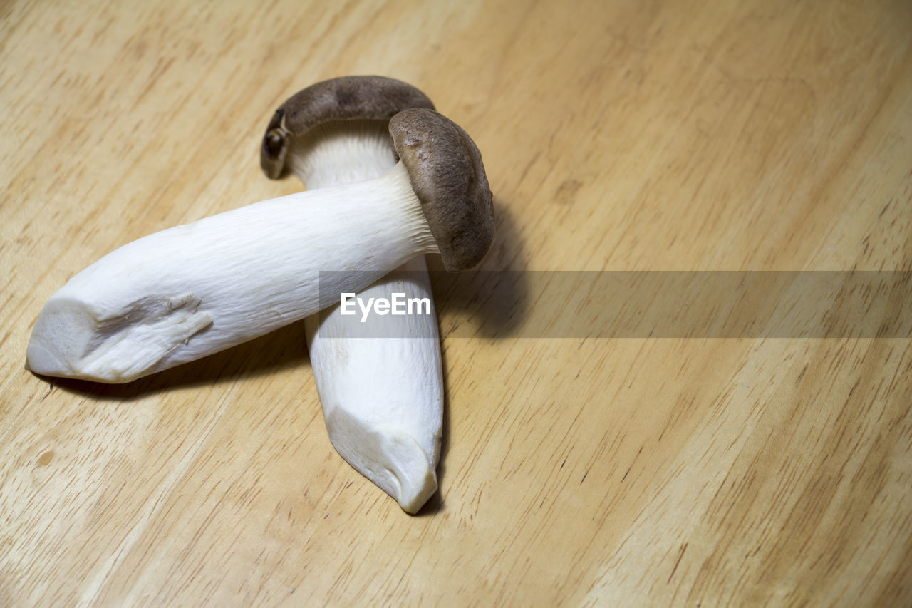 High angle view of mushrooms on chopping board