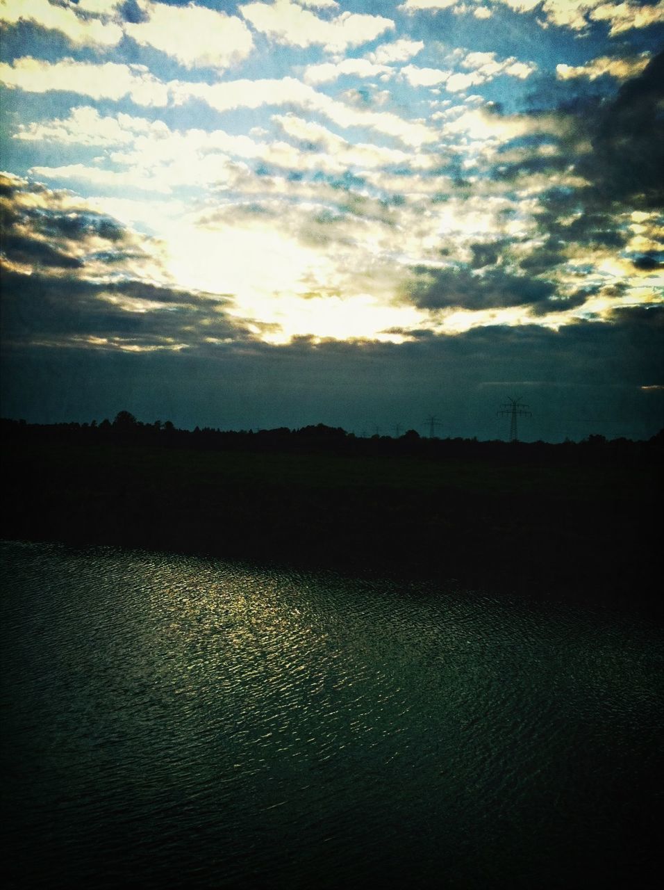 sky, reflection, cloud, water, beauty in nature, scenics - nature, tranquility, tranquil scene, nature, horizon, sunlight, morning, no people, dawn, environment, lake, darkness, silhouette, landscape, light, outdoors, sunrise, sun, idyllic, dramatic sky, non-urban scene, tree