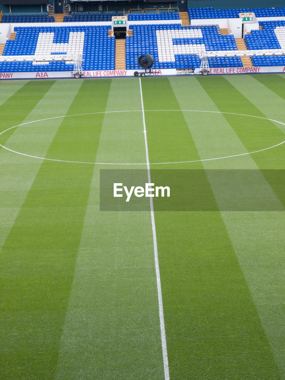 HIGH ANGLE VIEW OF EMPTY STADIUM ON GREEN GRASS